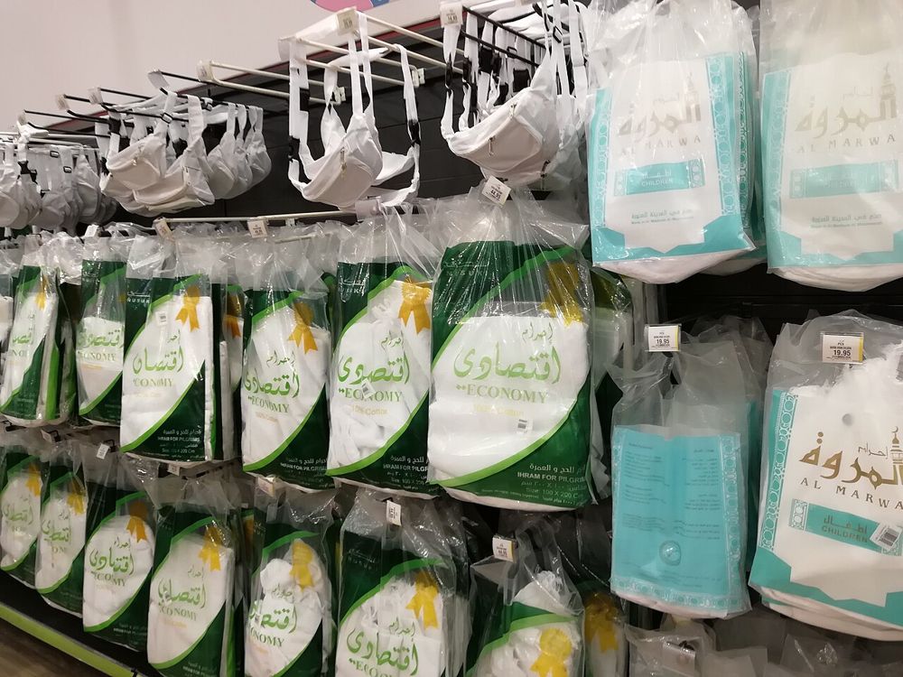 Packed Ihram sets on a shop shelf
